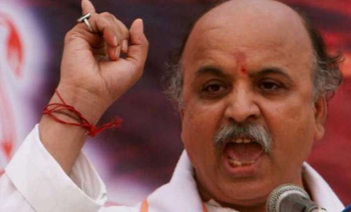 article 370 will have to go praveen togadia on release of