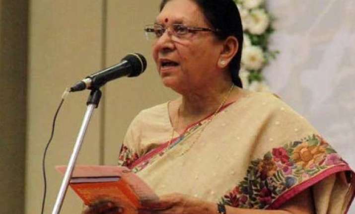 gujarat cm hails budget as pro people cong calls it jugglery