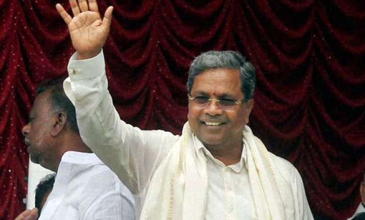 karnataka cm allots portfolios retains key departments