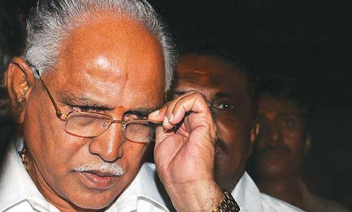 karnataka government totters as ministers back yeddyurappa
