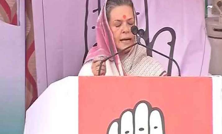 live sonia hits out at bjp says it is neck deep in