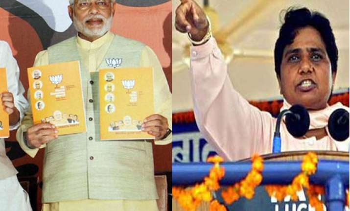mayawati demands action against bjp for manifesto