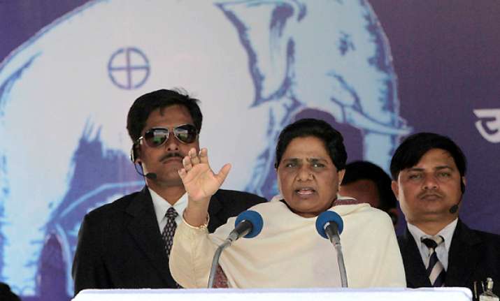 mayawati asks voters to give befitting reply for covering