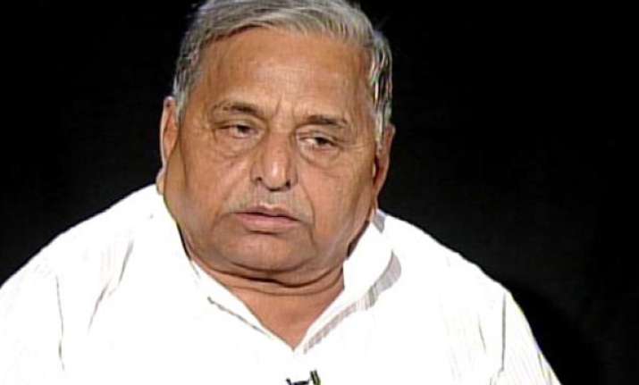 mayawati govt snatching away farmers land for builders says