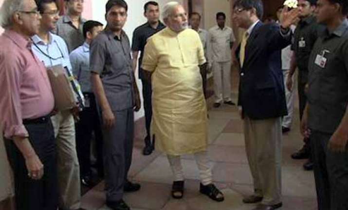 modi walks through pmo posts picture
