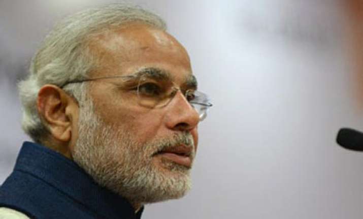 modi welcomes advani s decision to stay on