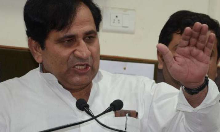 shakeel ahmed attacks rajnath over modi visa row
