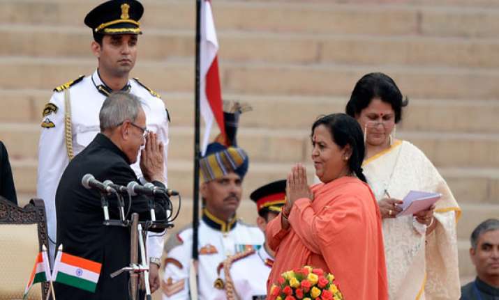union minister uma bharti tweets her portfolio deletes it