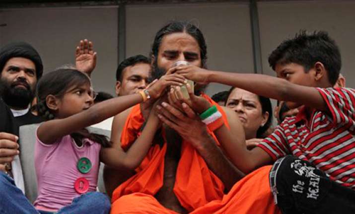 ramdev ends fast calls for defeat of cong in next polls
