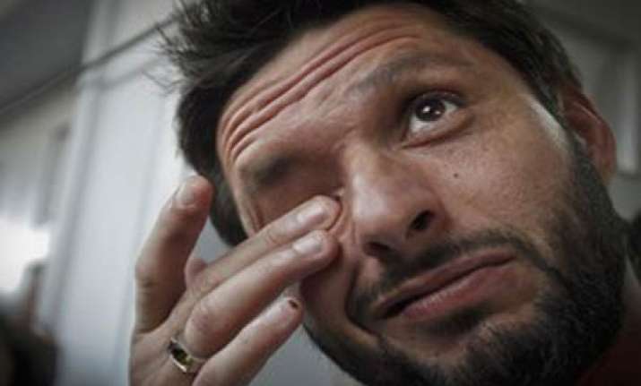 afridi quits international cricket slams pcb