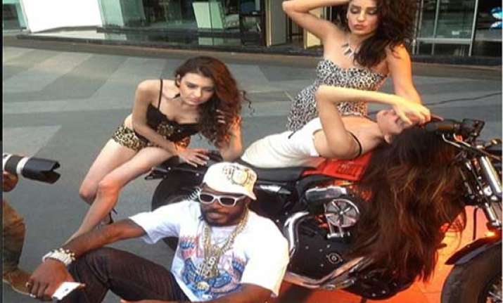 chris gayle might be missing the cricket but he is having
