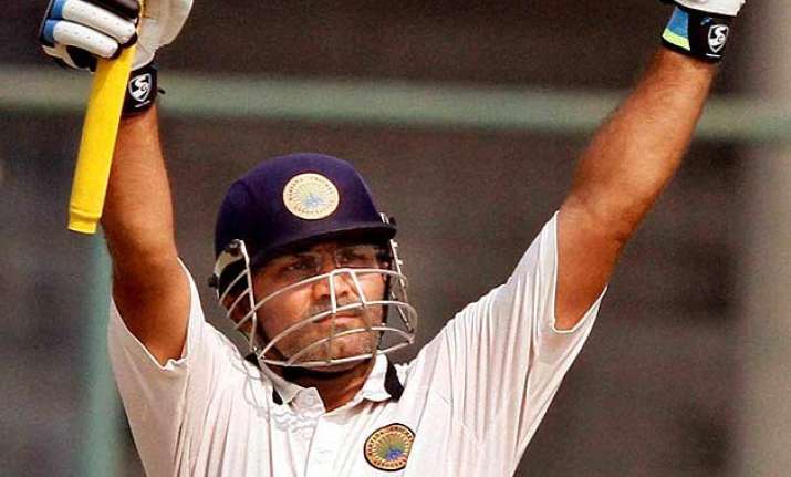 ms dhoni leads praise for sehwag compares him to viv