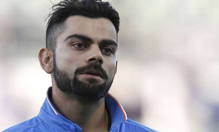 kohli s pakistani fan faces 10 year jail for hoisting tri