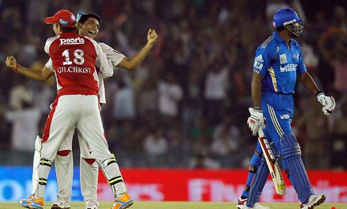 kings xi stay in play off hunt with upset win over mumbai