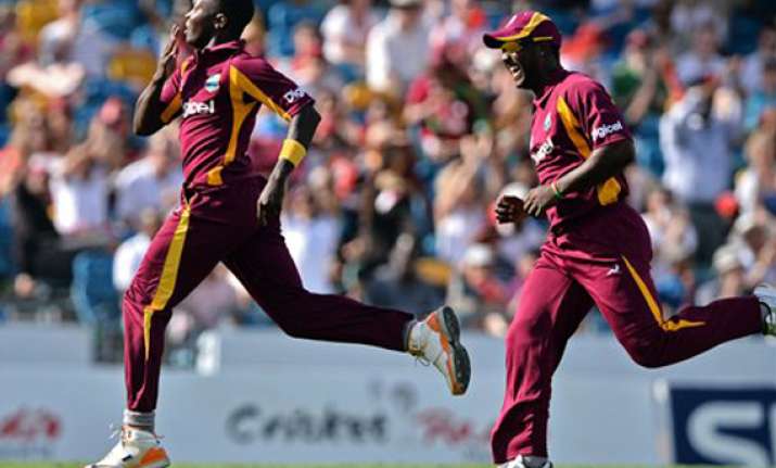 windies beat australia by 14 runs in 2nd t20