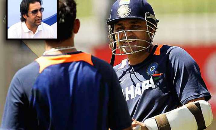 wasim akram backs dhoni says sehwag doesn t qualify as