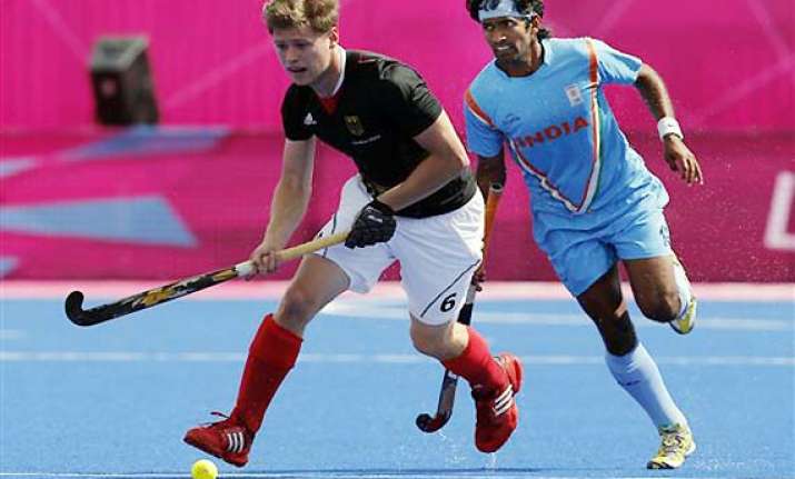 champions hockey india lose to germany but top group