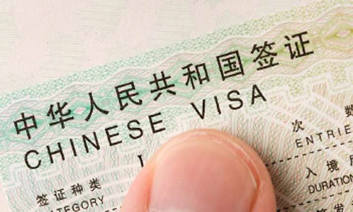 beijing defends stapled visas says policy consistent and