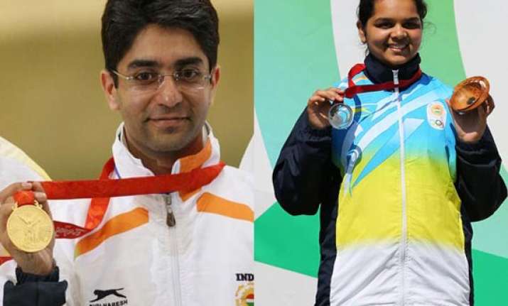 cwg 2014 bindra clinches gold malaika wins silver in