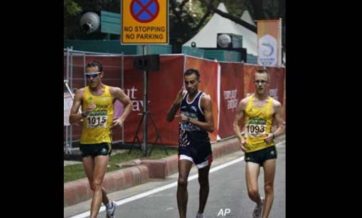 harminder wins bronze in men s 20km walk event