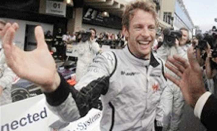 jenson button clinches formula one victory in brazil