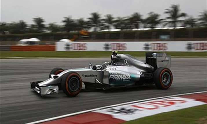 lewis hamilton takes pole at malaysian gp.
