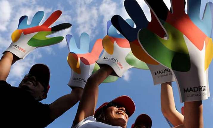 madrid slashes games bid budget amid economic woes