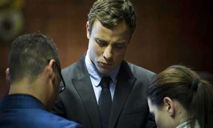 pistorius says he mourns for girlfriend he killed