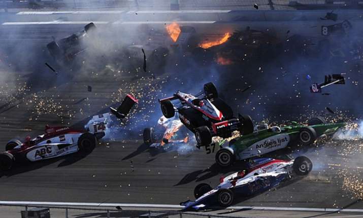 terrifying pics as indycar champion dies in ball of flames