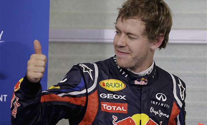 vettel takes pole at abu dhabi gp