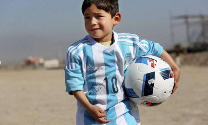 messi replaces five year old afghan boy s plastic bag