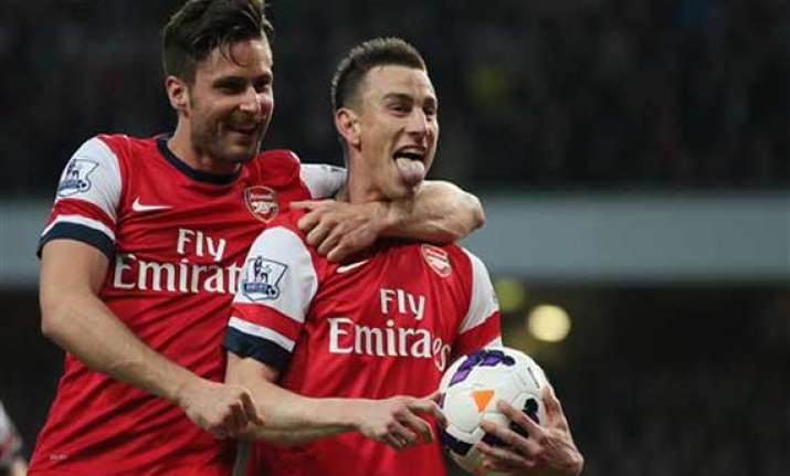 arsenal beats newcastle 3 0 to cement fourth spot