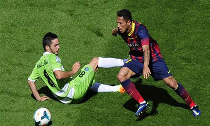 barca s title defense hit by 2 2 draw with getafe