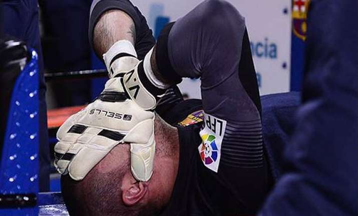 barcelona goalkeeper victor valdes tears knee ligament.
