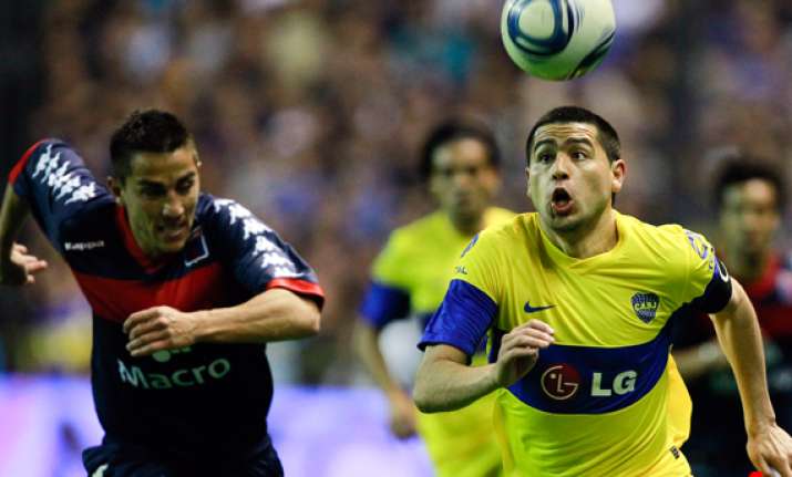 boca stays on top in argentina despite draw