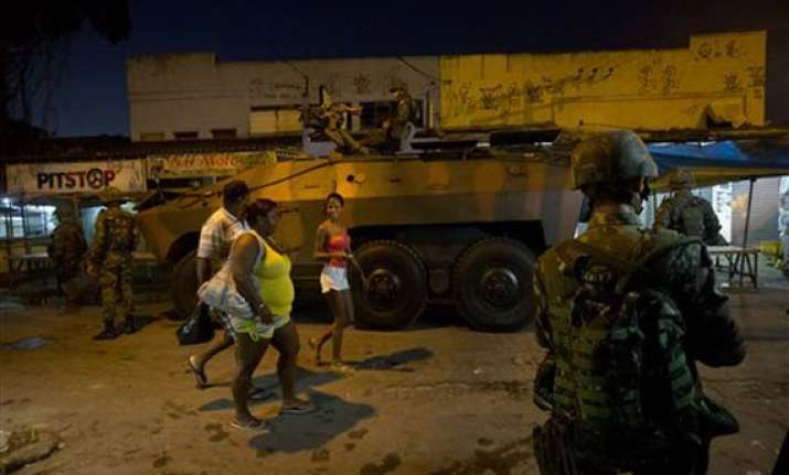 brazil security forces raid rio slum before wcup