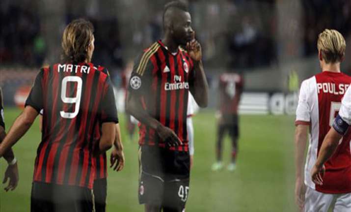 champions league ajax holds milan to 1 1 draw in group h
