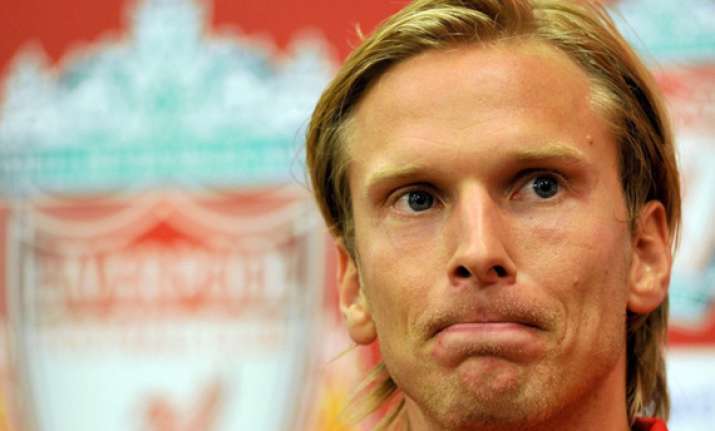evian signs christian poulsen from liverpool