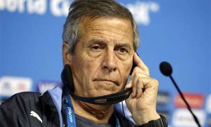 fifa world cup tabarez defends suarez against biting claims