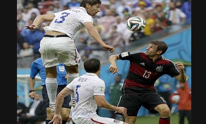 fifa world cup germany tops group on muller s stellar show