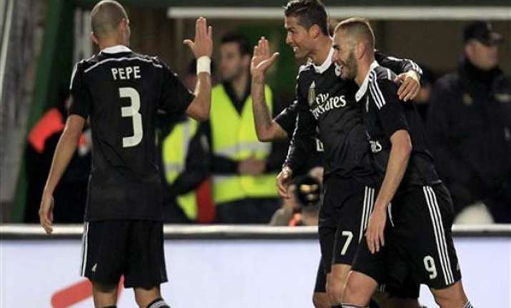 ronaldo scores to help madrid win 2 0 at elche extend lead