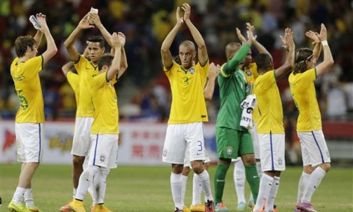 brazil players told not to wear hats earrings