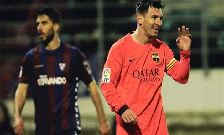 messi nets 31st 32nd league goals as barca protects lead