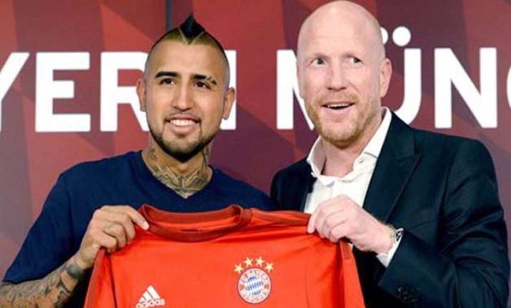 bayern munich signs chile midfielder arturo vidal
