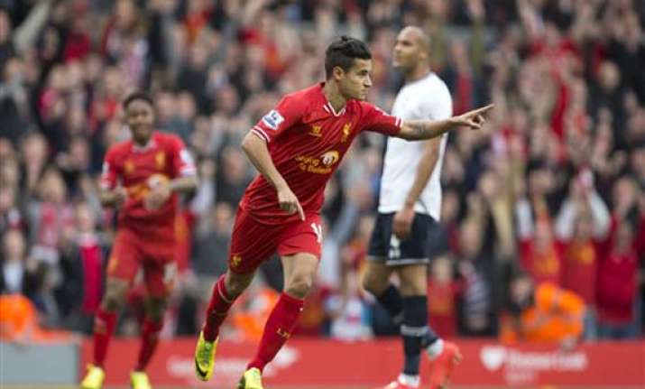 liverpool beats spurs 4 0 tops premier league