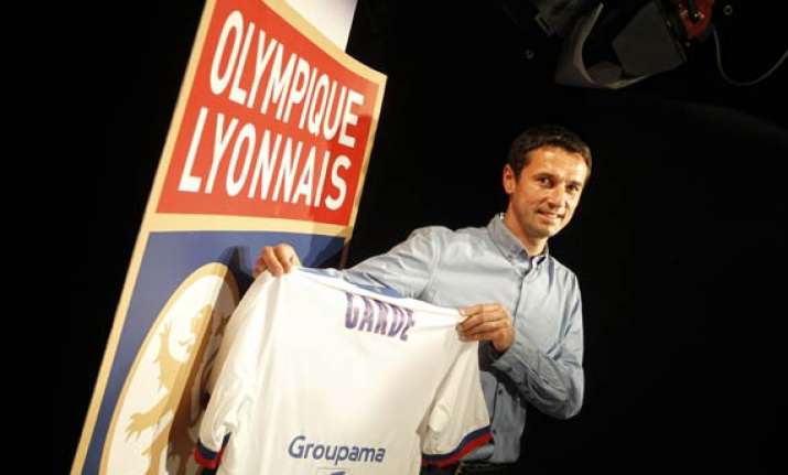 lyon names garde as new coach