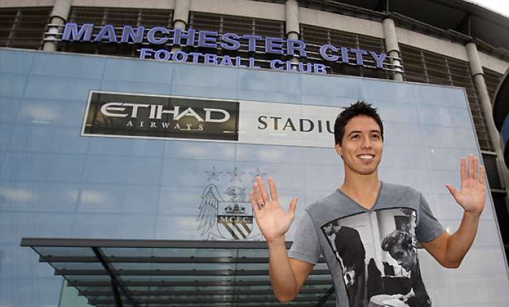 man city completes signing of nasri from arsenal