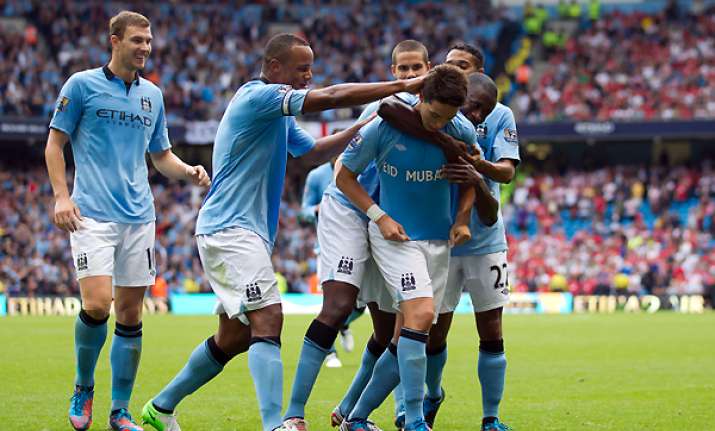 man city recovers to open title defence with win