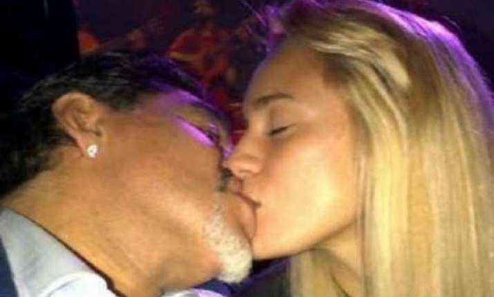 maradona fumes as his young fianc e flirts with united s de