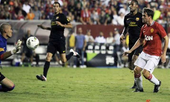 owen gives man utd 2 1 win over barcelona